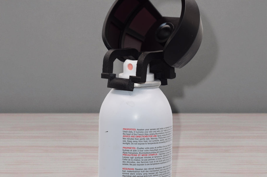 Black Spray Doctor mounted on a spray can in open position, front perspective view
