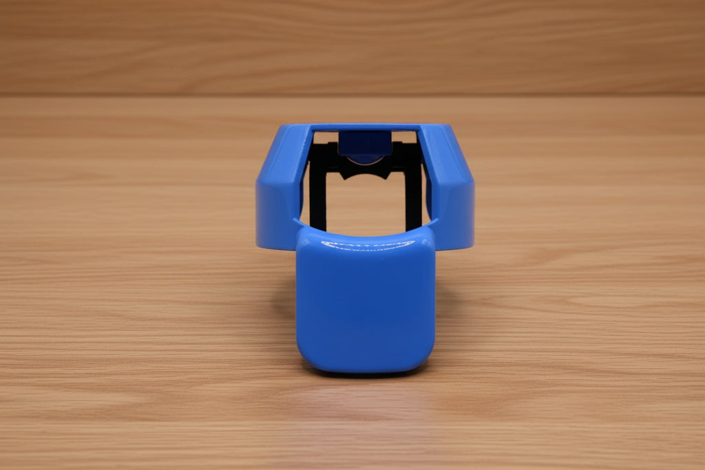 Blue ergonomic spray can adapter, Spray Doctor, on a wooden surface - front perspective view.
